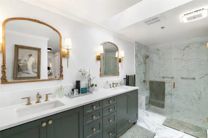 All new cabinets and counter, heated towel rack and oversize walk-in shower with no rise... easy access.  Two shower heads and bench seat.