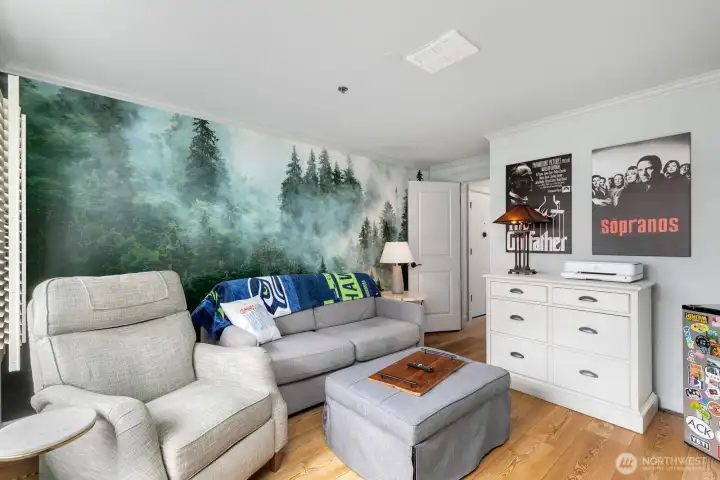 Custom northwest wall paper and room for lounging, workout, or office space.