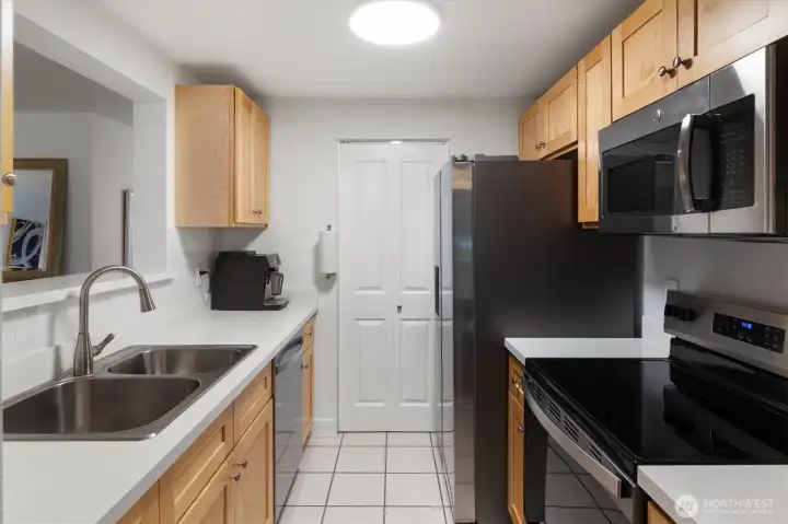 bright wood cabinets, solid counter tops,