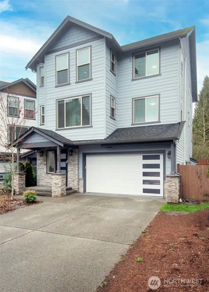 Open-concept main floor living defines this sleek and impressive standalone home.