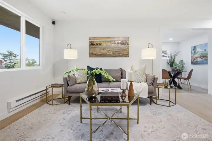 Entry way to family room/flexible use space is to the right of the sofa in this photo frame.