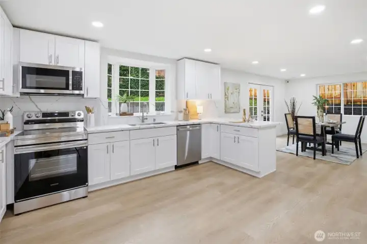 The spectacular kitchen is unquestionably the heart of this home. Abundant use of glass allows natural lighting to stream in, and on those grayer PNW days, use sophisticated adjustable lighting to bring cheerful energy to all your activities.