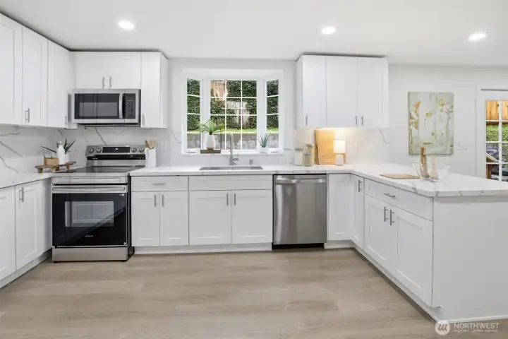 Mullioned windows and doors frame seamless connections to the outdoor living spaces.