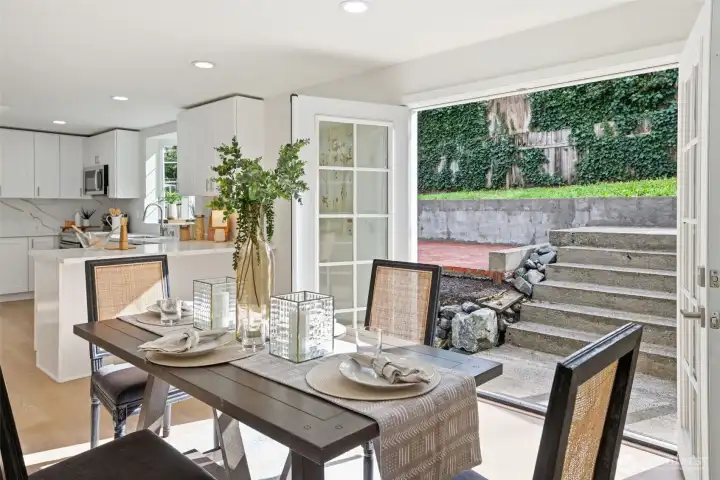 Dining opens to pretty gardens and patios-create artistic scenery with your own selections of color and texture in the yard.