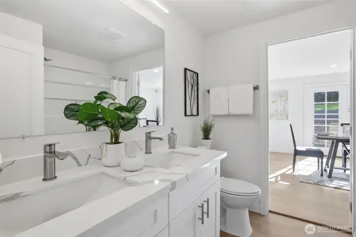 Stylish quartz bath is accessible from both main hall and dining areas.