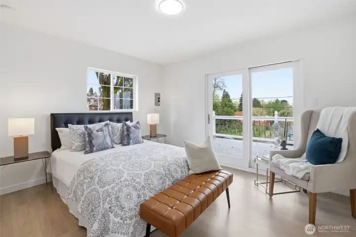 Spacious primary bedroom is on the Upper Level. Your very own private balcony invites quiet inspiration as your morning begins, and helps you unwind as the sun goes down against the backdrop of the Olympics and the City skyline.