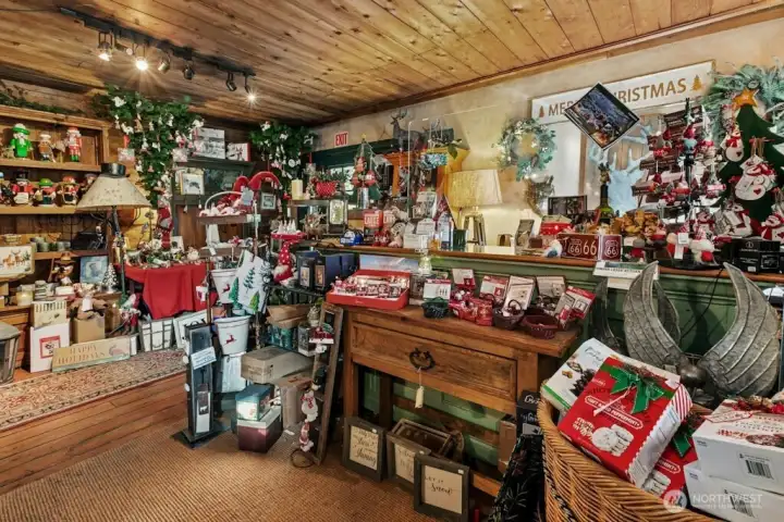 Main entry of The Christmas Shop at Timber Creek business, check out area.  This use to be the Carriage House many many years ago! Original wood flooring.
