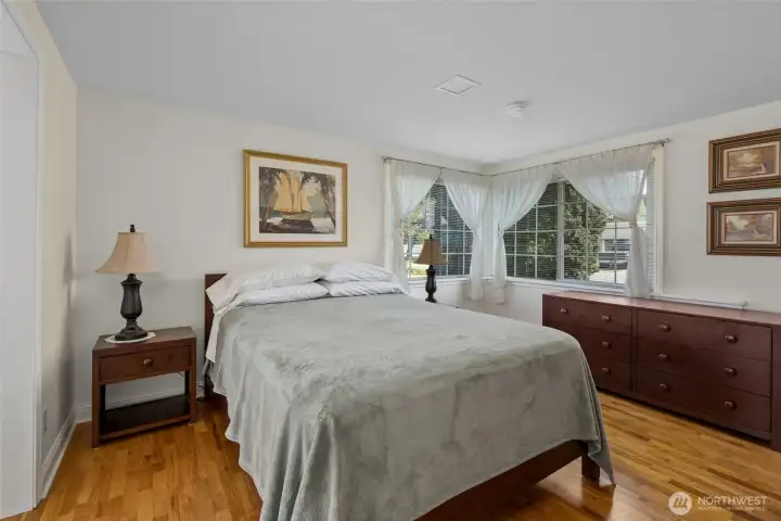 Primary bedroom. Yes, those are hardwood floors!