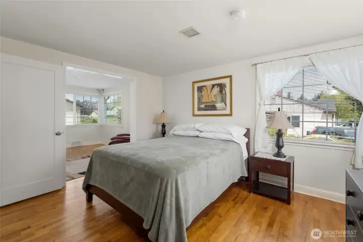 Primary bedroom is open to adjacent sitting room.