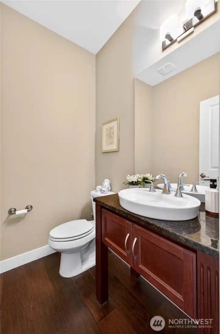 Conveniently located guest bath just off the entry offers easy access from all areas of the main floor.