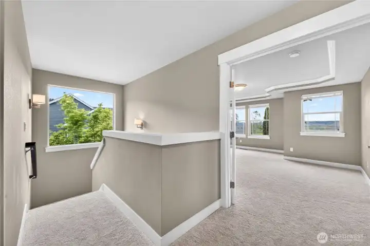 Spacious upstairs landing filled with natural light and a comfortable, open feel.