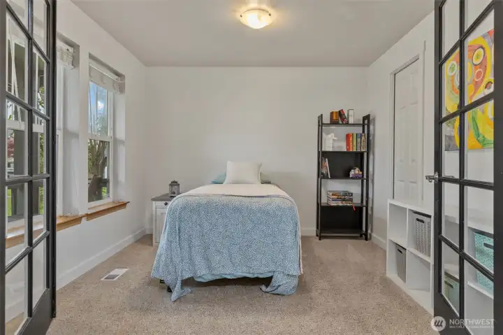 Main floor office with French doors and a view of the street