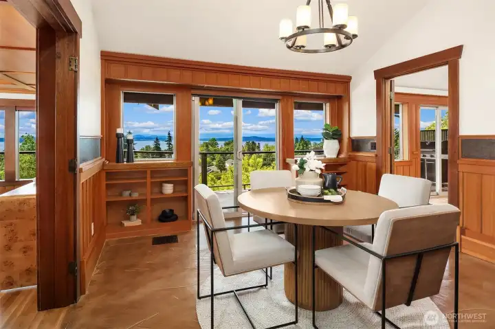 The formal dining room can handle the largest dinner parties and boasts vaulted ceilings and custom built-ins as well as easy access to the deck. The formal dining room can handle the largest dinner parties and boasts vaulted ceilings and custom built-ins as well as easy access to the deck.