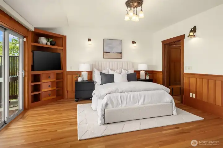 This king sized primary bedroom features custom built-ins, access to the covered deck and a private en-suite. This king sized primary bedroom features custom built-ins, access to the covered deck and a private en-suite.