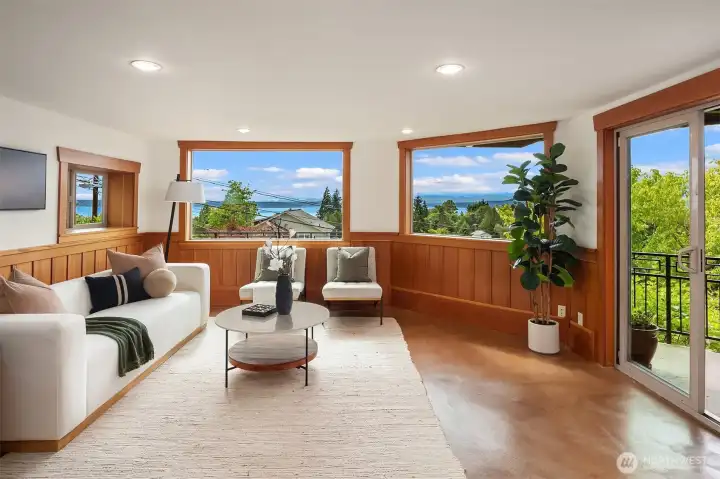 As you descend the wood adorned staircase you enter the family room where the amazing woodwork and views continue in this daylight basement. As you descend the wood adorned staircase you enter the family room where the amazing woodwork and views continue in this daylight basement.