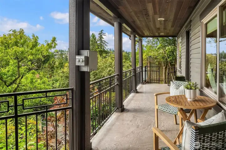 Another full width deck with iron railings and natural wood soffits as well as incredible views. Another full width deck with iron railings and natural wood soffits as well as incredible views.