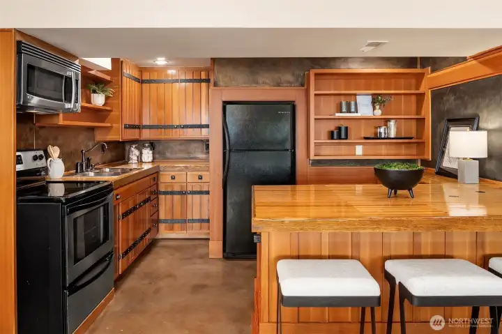 The lower kitchen is fully equipped with an oven, microwave, sink and fridge and even a breakfast counter. The lower kitchen is fully equipped with an oven, microwave, sink and fridge and even a breakfast counter.