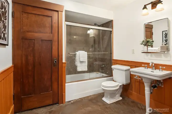 The lower bathroom includes a full size tube and pedestal sink. A newer gas hot water heater is in the closet. Brand new LG full size washer and dryer are just outside the bath to the right in a laundry closet. The lower bathroom includes a full size tube and pedestal sink. A newer gas hot water heater is in the closet. Brand new LG full size washer and dryer are just outside the bath to the right in a laundry closet.