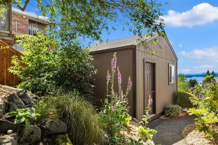 Just outside off the carport is this spacious powered and sheetrock outbuilding great for storage, work shop or finish off for a home office or studio. Just outside off the carport is this spacious powered and sheetrock outbuilding great for storage, work shop or finish off for a home office or studio.