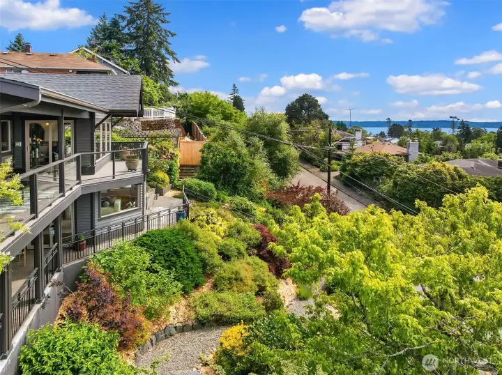 Looking down on the front landscaping meandering pathways intertwine the gorgeous landscaping. Looking down on the front landscaping meandering pathways intertwine the gorgeous landscaping.