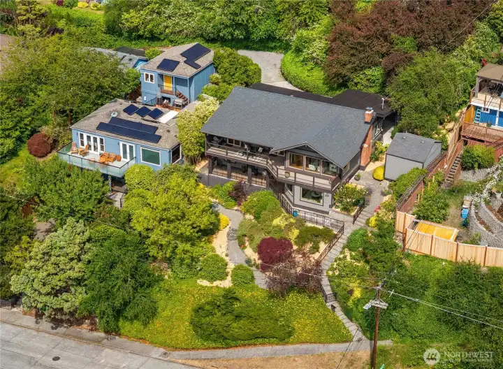 Located above 47th Ave SW, the house holds a commanding presence with the hilltop perch ensuring unblockable views. Located above 47th Ave SW, the house holds a commanding presence with the hilltop perch ensuring unblockable views.