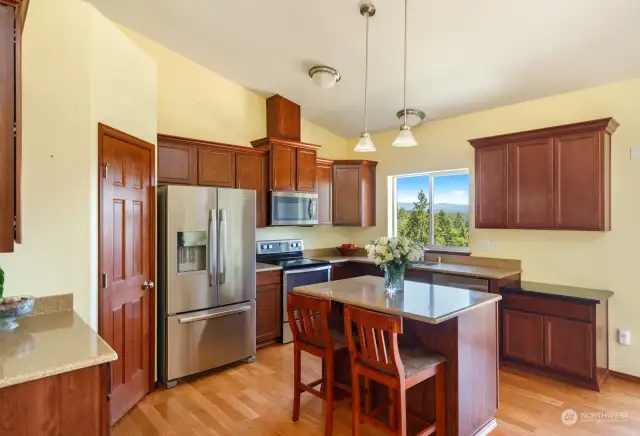 This is a kitchen you can move around in and still be part of any gathering you have here.  The kitchen window has a fantastic lake and mountain view.