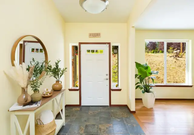 The tiled front entry has plenty of space for shoes, coats, jackets and the like but there is also a coat closet just to the left of this photo.
