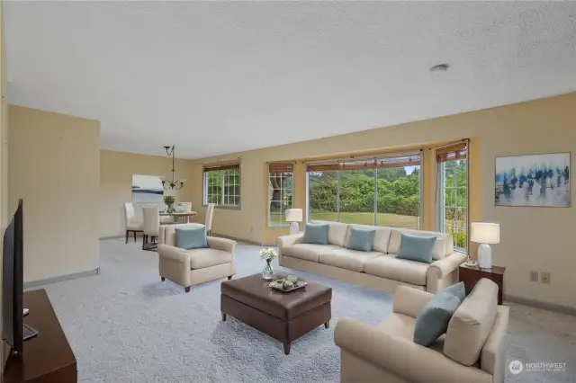 *Virtually stage* To the right of entry, is the spacious living room with natural light beaming through these large windows.