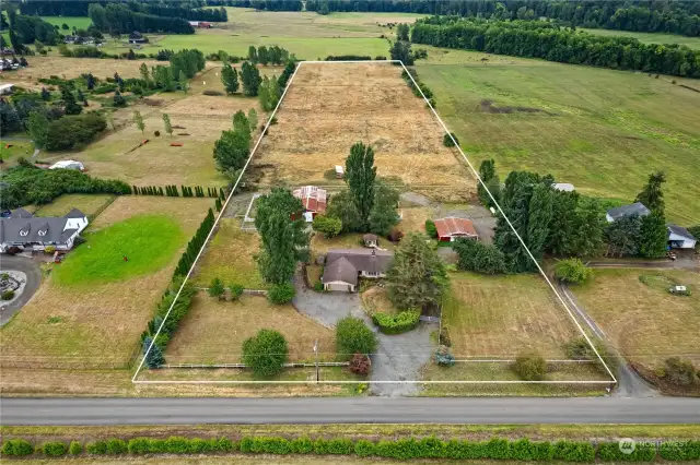 Just shy of 10 flat acres that are fenced/cross fenced complete with two separate barns.