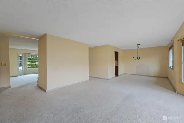 From the living room this angle showcases the flow from the living room, to the dining area.