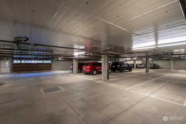 Very roomy to drive in and out of parking garage.  There are two garage doors to access the garage on each side of the building depending on where your parking is located.  Unit 201 is on the North side.