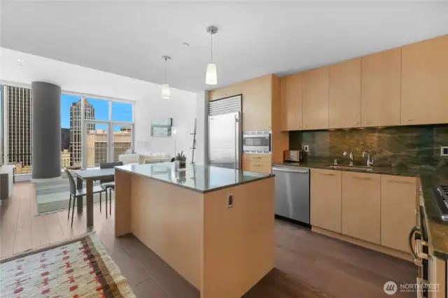 Modern kitchen with high end appliances including Subzero fridge.