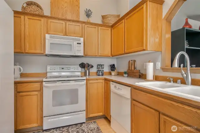 Ample counter space and a pee-through window to the family room
