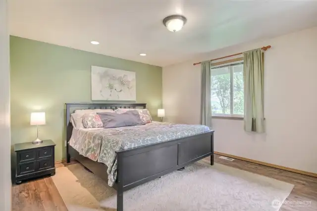 The primary bedroom is spacious - easily fits a king size bed plus nightstands.