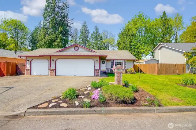 This amazing rambler has a 3 car garage with drive-through access.