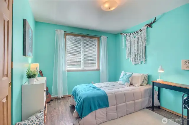 The second of the two bedrooms is also light and bright, and located directly across from the hallway bathroom