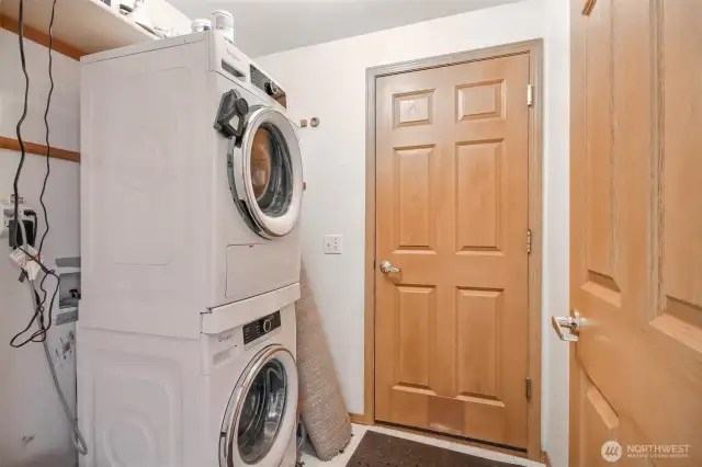 The laundry room, just off the garage currently has a stackable washer and dryer but was originally designed with side-by-side in mind.  W/D goes with seller.