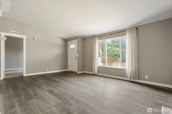 Step inside to a bright and welcoming living area filled with natural light