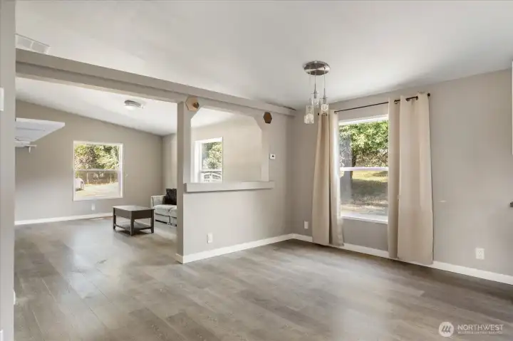 Open-concept dining area seamlessly connected to the family room, perfect for entertaining and everyday living