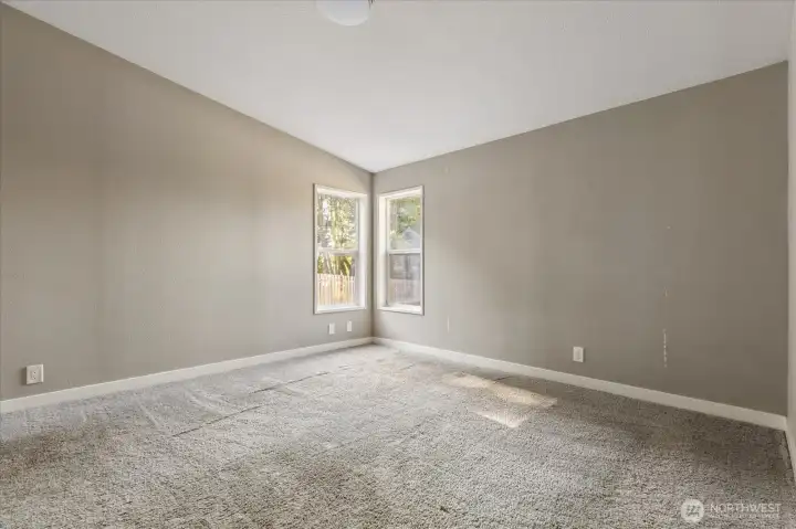 Spacious primary bedroom featuring a private ensuite bathroom