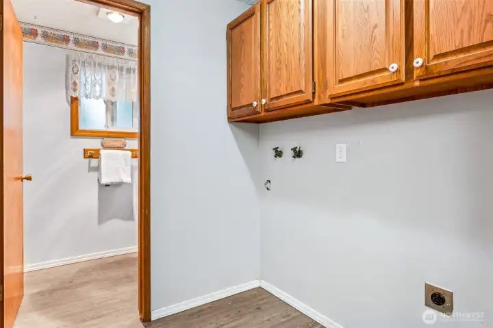 Laundry area adjacent to half bath and convenient to main living area