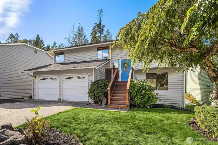 Large 2 car garage with driveway parking space and street parking