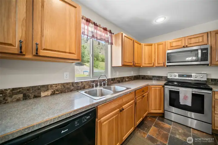 Beautiful cabinets and an awesome view out the window towards the back yard.