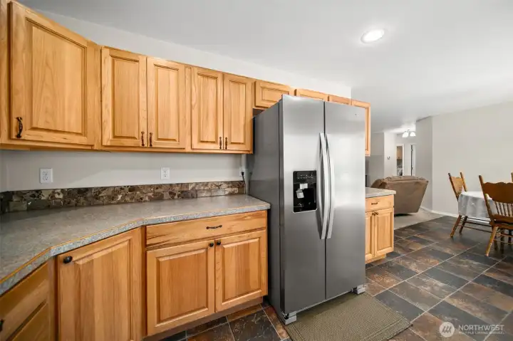 Another view of the kitchen and dining room.