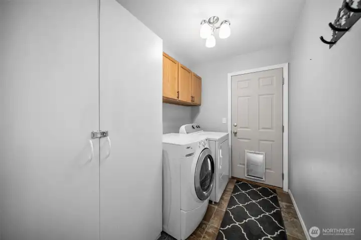 Laundry room with door to the side yard.