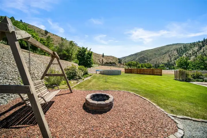 Bigger fire pit area towards the edge of the back yard.