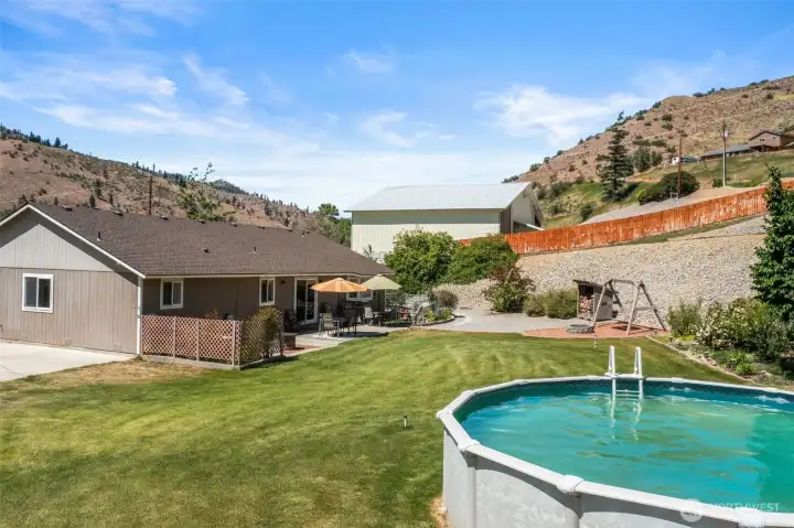 Above ground pool and back yard.