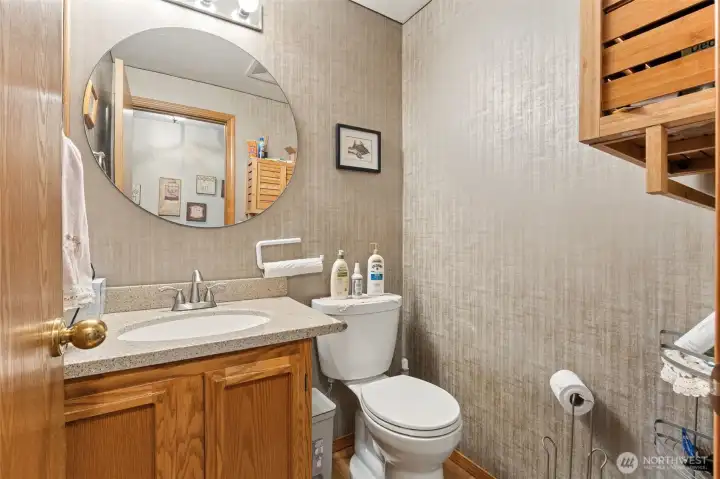 Downstairs powder room located in the central hallway.