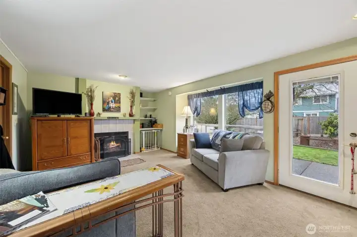 Family room is open to the kitchen area with a large picture window over looking the tranquil backyard with easy access through the glass door.