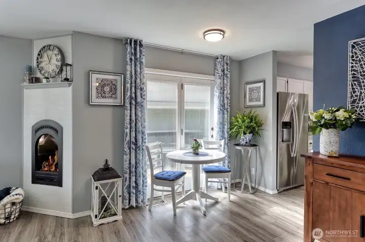 Cozy gas fireplace and deck access through the sliding door